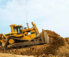 Bulldozer moving dirt on construction site